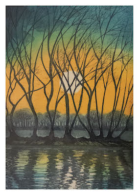 Bare trees silhouetted against a sunset with a bright sun reflecting on calm water.