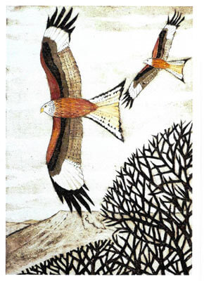 Two birds with brown and white wings flying over a brown mountain and leafless bush.